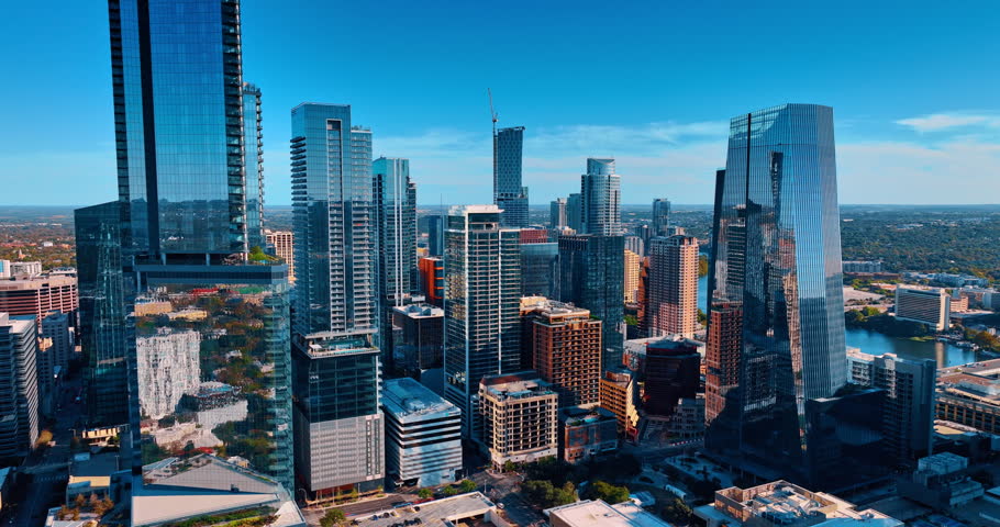 Glass and concrete skyscrapers in the dense urban landscape of modern city. Drone flight in downtown Houston, Texas, USA.