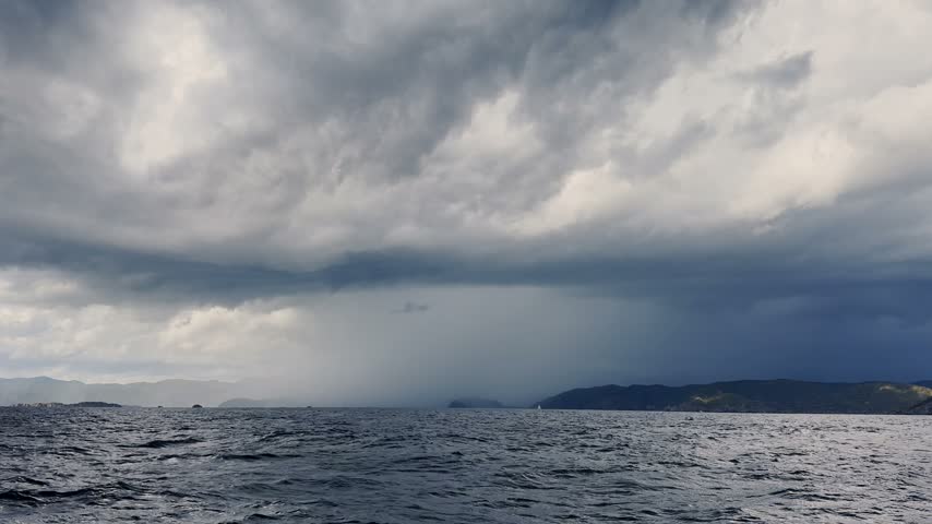 Incredible stormy landscape, storm clouds over the mountains, Turkey, Marmaris, sailing boat at stormy weather, blue water, stormy clouds with rain