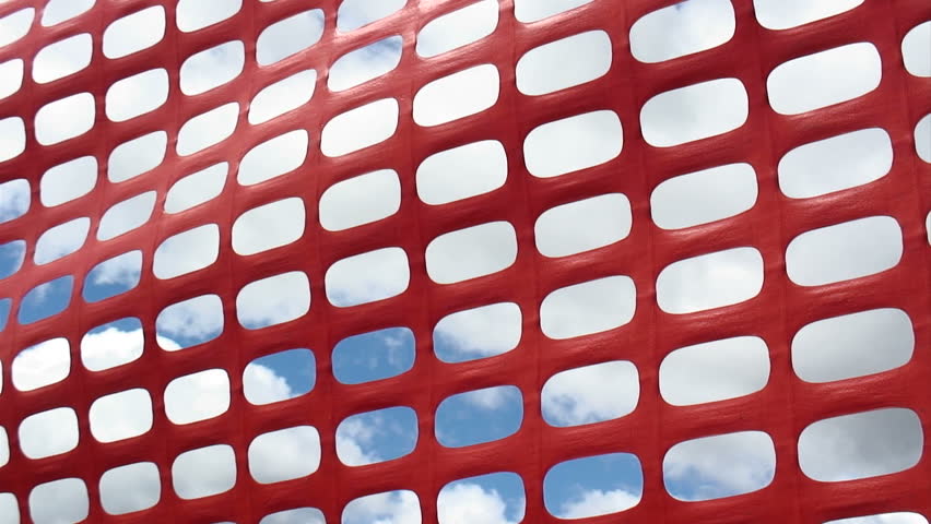 Orange plastic with clouds and sky visible through gaps in the mesh.