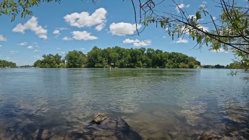 Scenic view of a bend in the Sacramento River on a bright summer day