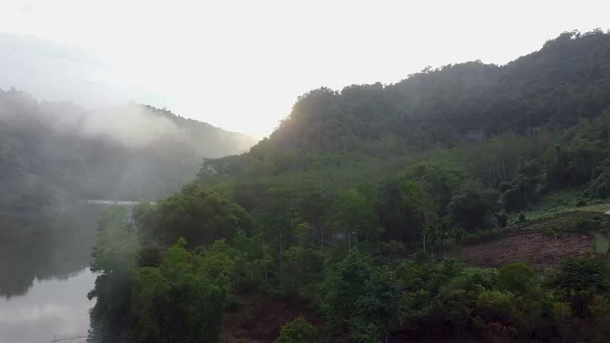 Foggy forest hills aerial view in the morning