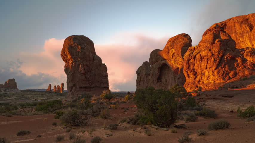 Arches National Park time lapse. Red sandstone cliffs in Utah, USA. Sunset video loop cinemagraph
