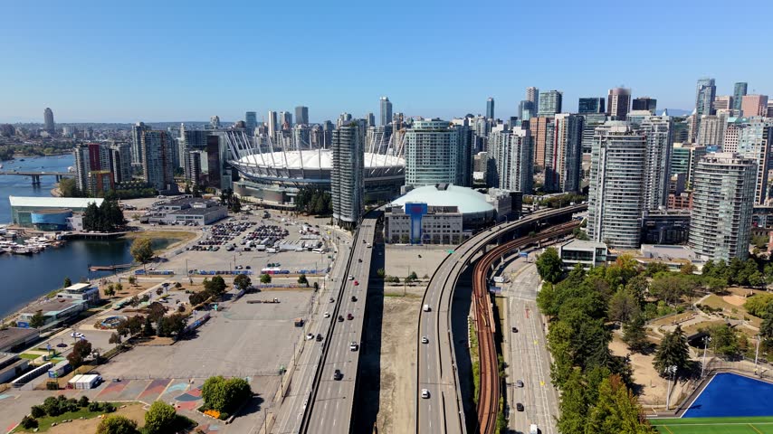 Downtown Vancouver Skyline With The Iconic BC Place Stadium And Rogers Arena In British Columbia, Canada. - aerial shot