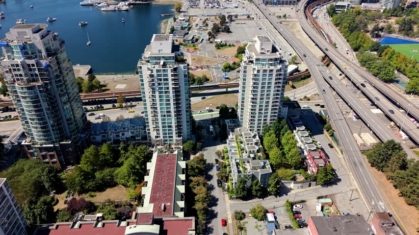 High-rise Residential Towers Overlooking False Creek In Vancouver, British Columbia, Canada. - aerial shot