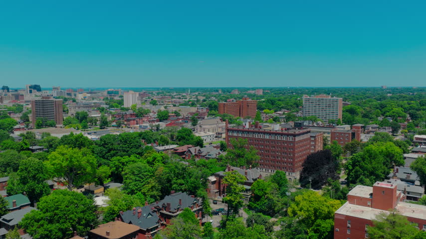 Neighborhood mixed with large apartment complexes and historic homes. Louisville, Kentucky, this scene is perfect for housing market updates, property management.