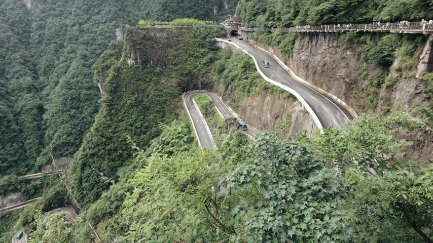 Winding mountain road leading toward famous Heaven Gate Hole in Tianmen Mountain, Zhangjiajie.