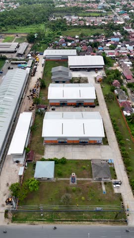 Warehouse complex seen from above with surrounding green areas in South Kalimantan Indonesia