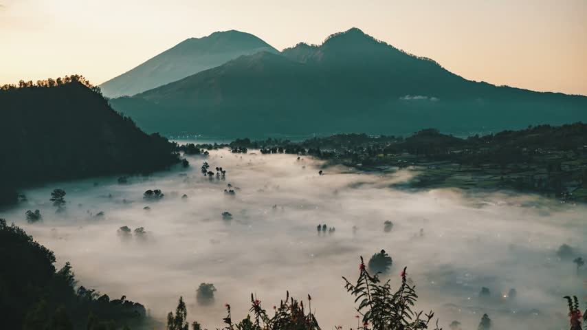 Golden hour timelapse over the sea of clouds, captured from Kintamani Bali overlooking Mount Batur