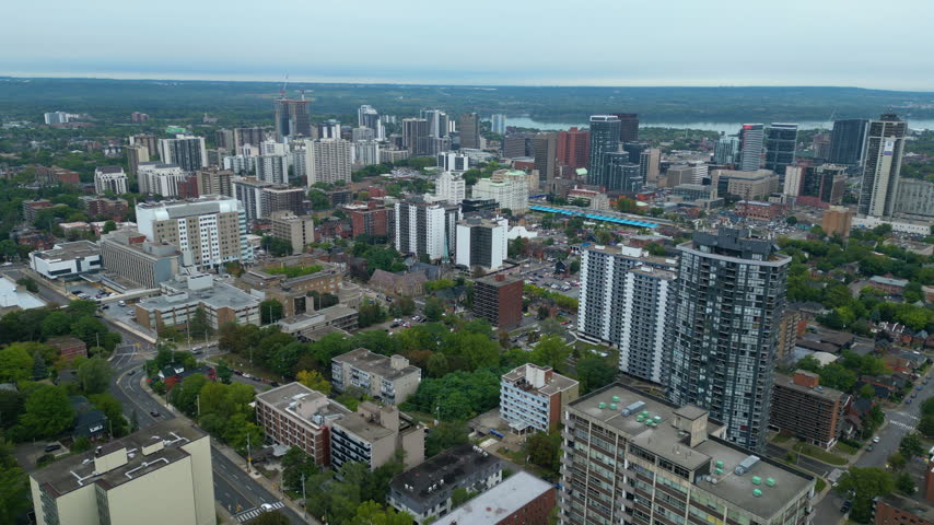 Aerial view of downtown Hamilton Ontario on an overcast day with the bay in the distance.