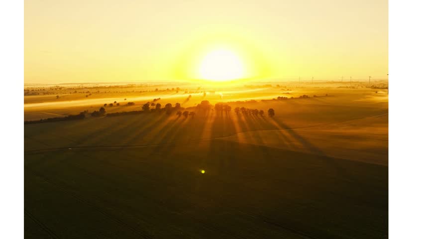 Beautiful sunset with warm golden sunlight creating a peaceful and scenic evening atmosphere.