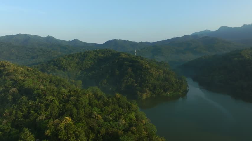 Atmospheric aerial footage of tropical lake and sunrise landscape