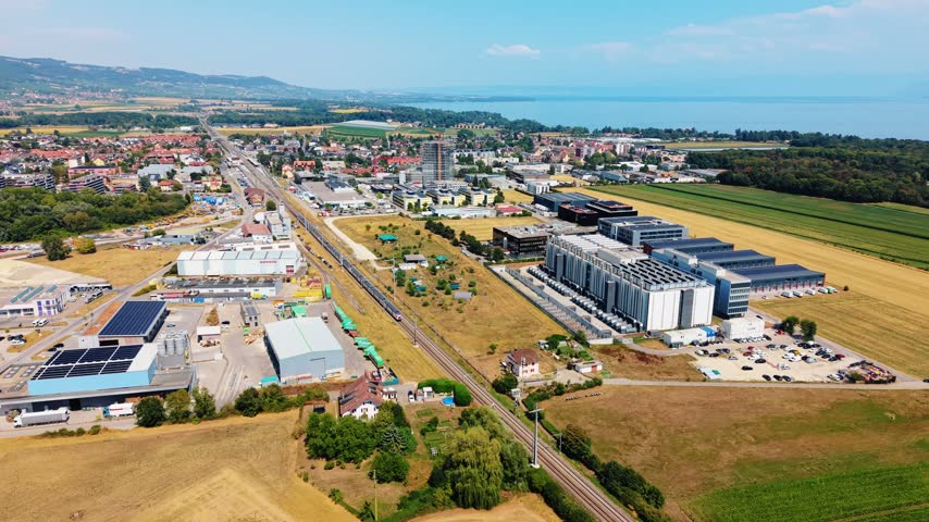 Drone orbits data center infrastructure overlooking Lake Geneva Switzerland
