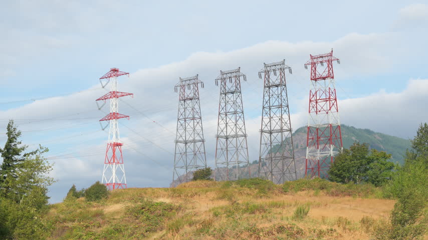 View of high-voltage transmission towers near Bonneville Dam in Oregon, carrying electricity from the hydroelectric facility through the Pacific Northwest.