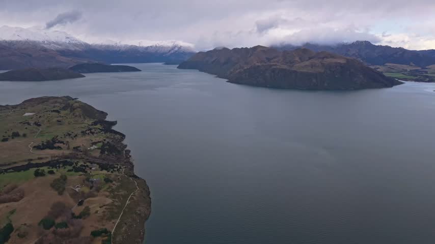 Aerial view over Lake Wanaka with Ruby Island and surrounding winter landscape