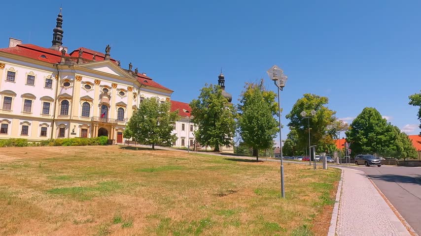 Splendid summer view of Hradisko Monastery (Klaster Hradisko). Sunny afternoon cityscape of Olomouc town, eastern province of Moravia, Czech Republic, Europe. 4K video (Ultra High Definition).