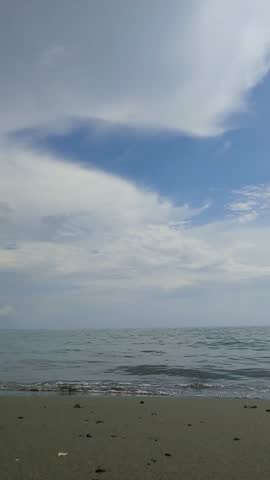 Seascape, horizon, waves, beach, clouds.