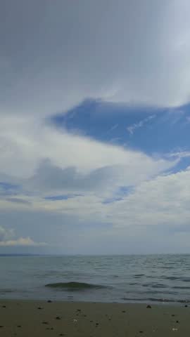 Seascape, horizon, waves, beach, clouds.