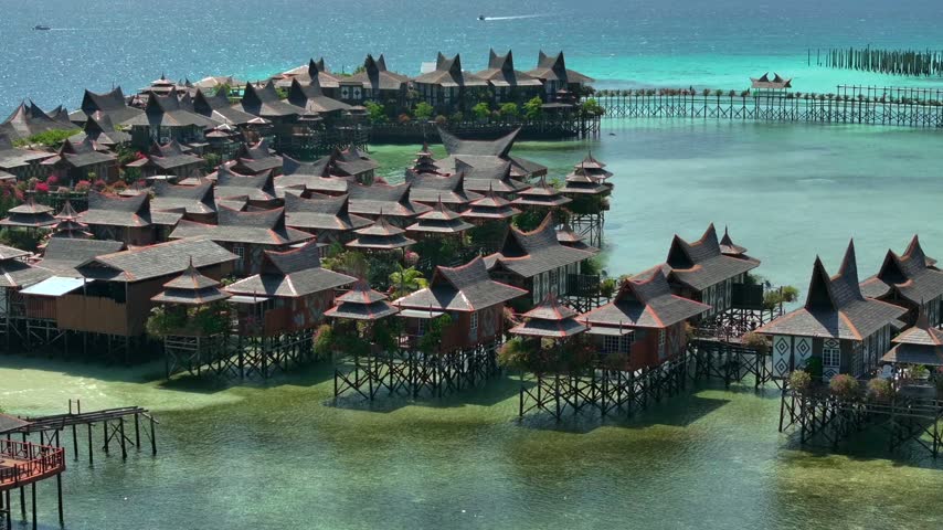 Luxury Resort on a Beautiful Mabul Island. Blue sea with a coral reef and the beach, Aerial. Semporna, Sabah, Malaysia.