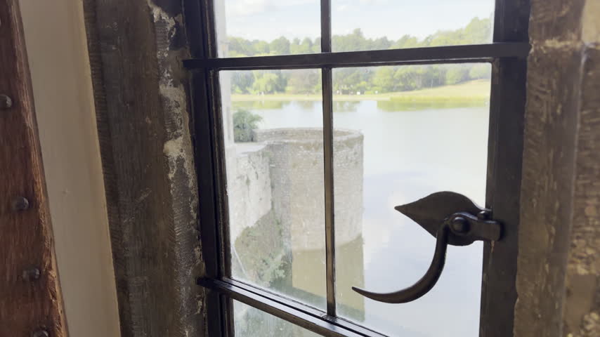 Two window latches facing lake panning