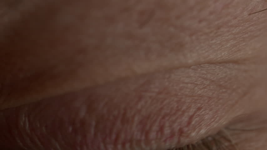 Human Eye Opening in Slow Motion with Extreme Macro Zoom into the Pupil