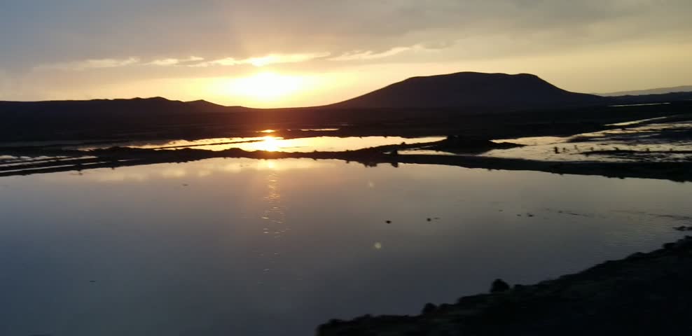 Scenic sunset over mountains and lake landscape