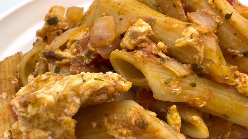 Penne Pasta with Tomato and Minced Meat Sauce Close Up