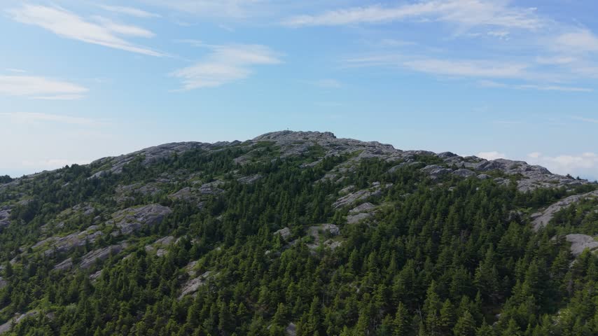Rocky summit of Mount Monadnock in New Hampshire. Aerial drone ascending, landscape