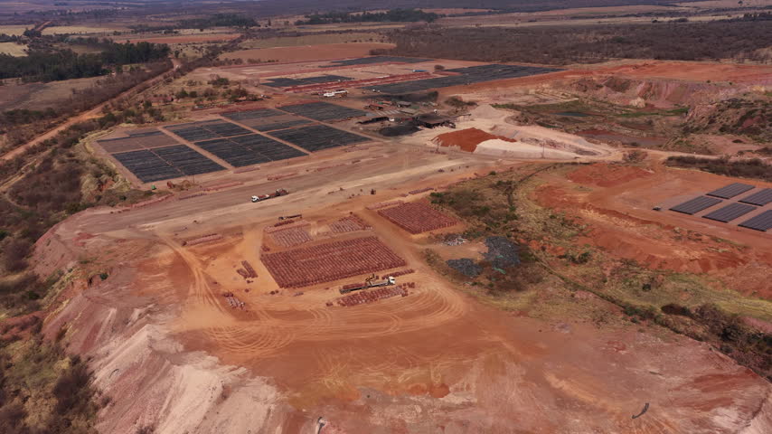Brick manufacturing at brickyard in brown dusty countryside, aerial view