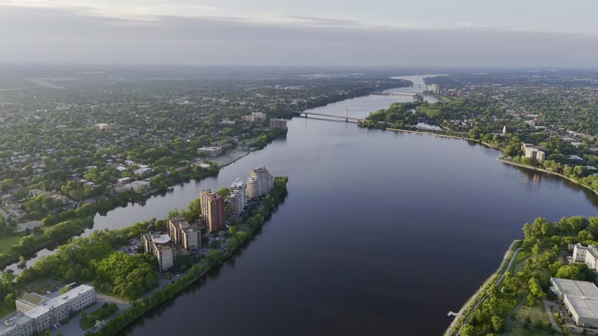 Aerial panoramic view of the Riviere des Prairies between Montreal and Laval, Quebec, Canada at sunset. g.