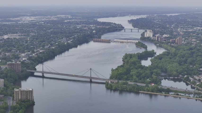 Aerial panoramic view of the Riviere des Prairies between Montreal and Laval, Quebec, Canada at sunset. g.
