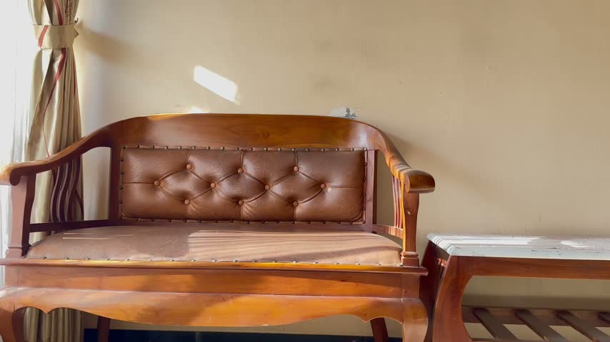 Video of a table and chairs set located in a cozy living room.