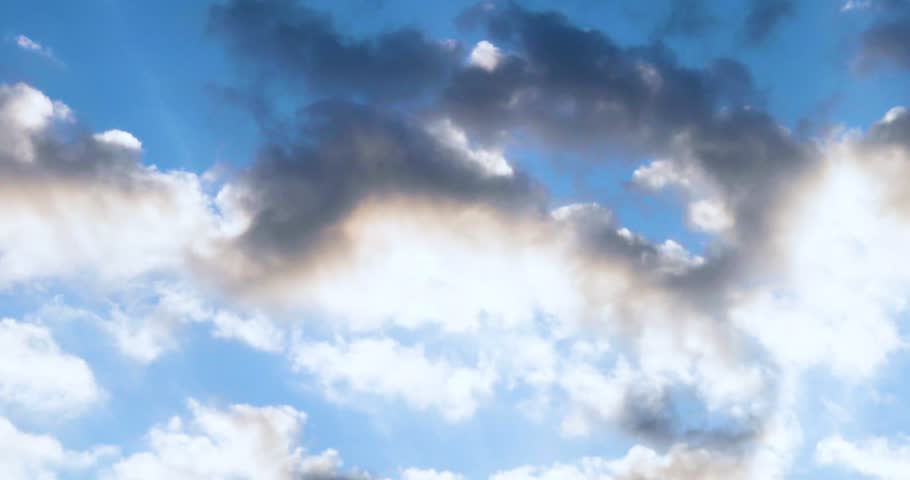 Morning sky with cumulus clouds and haze, backlit by the sun.