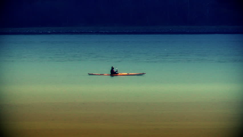 Kayak rower at sundown