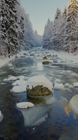 Beautiful Winter Mountain River Covered with Ice and Snow