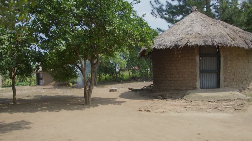 Traditional African Homestead in Village with Smoke in the Background of a Mud Hut 2