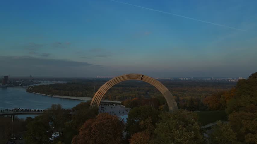 Drone flight over Arch of Freedom overlooking Dnieper River in Kyiv
