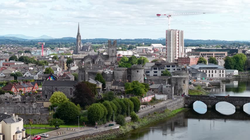 Limerick riverfront with castle, bridge and historical buildings. Drone cityscape, Ireland