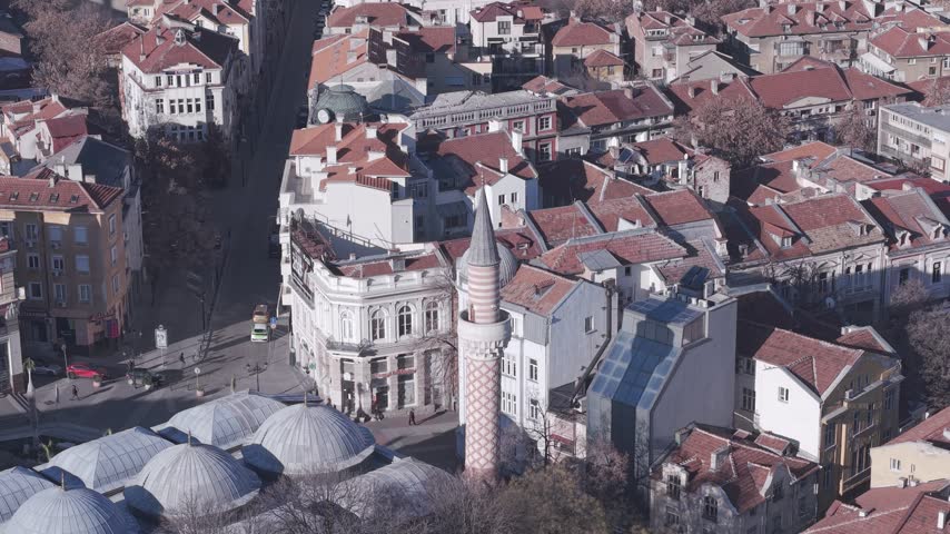 Aerial view of the historic Dzhumaya Mosque surrounded by traditional red-tiled rooftops and urban architecture in Plovdiv, Plovdiv Province, Bulgaria.