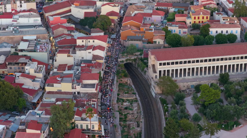 Aerial pan showing the cityscape of Athens, Greece, focusing on the historic Plaka and Monastiraki districts, Hadrian