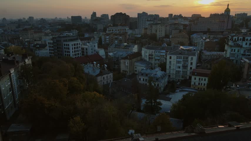 Aerial view over historic rooftops and architecture at sunset in Kyiv, Ukraine
