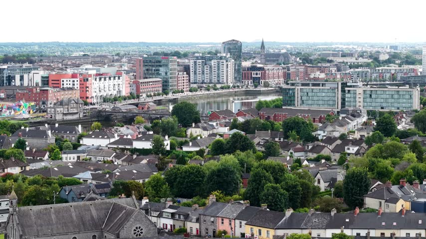 Limerick city, Ireland. Drone crane cityscape with riverfront and commercial buildings.