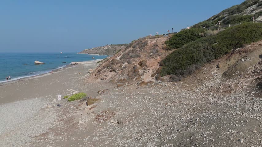 Aerial view of coastal cliffs and sandy beach along the mediterranean sea in Cyprus.