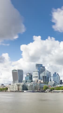 Time Lapse looking across the River Thames at the London Skyline. Vertical Video.