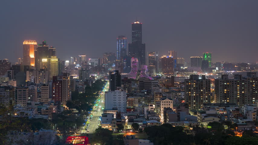 Kaohsiung City timelapse showing its futuristic skyline at night in southern Taiwan, zooming in. 