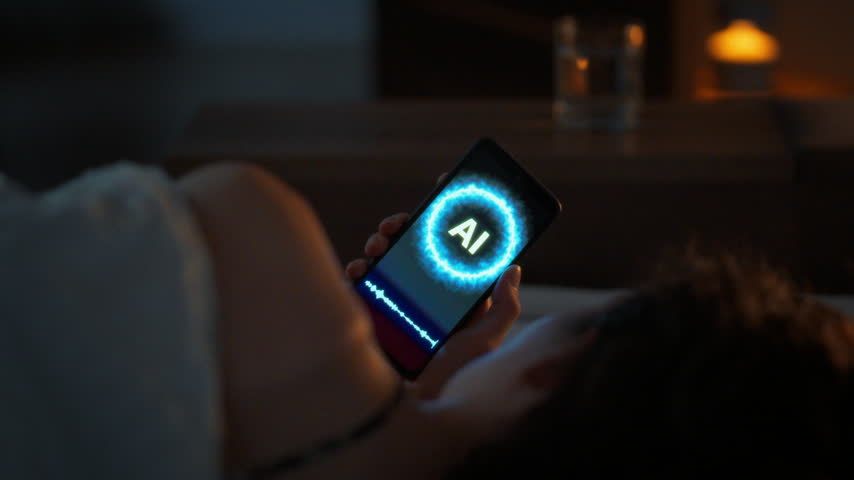 The loneliness of the digital generation. A young woman lies awake at night in a dark bedroom talking to an AI assistant on her smartphone. Cold moonlight from the window. Light from an open door