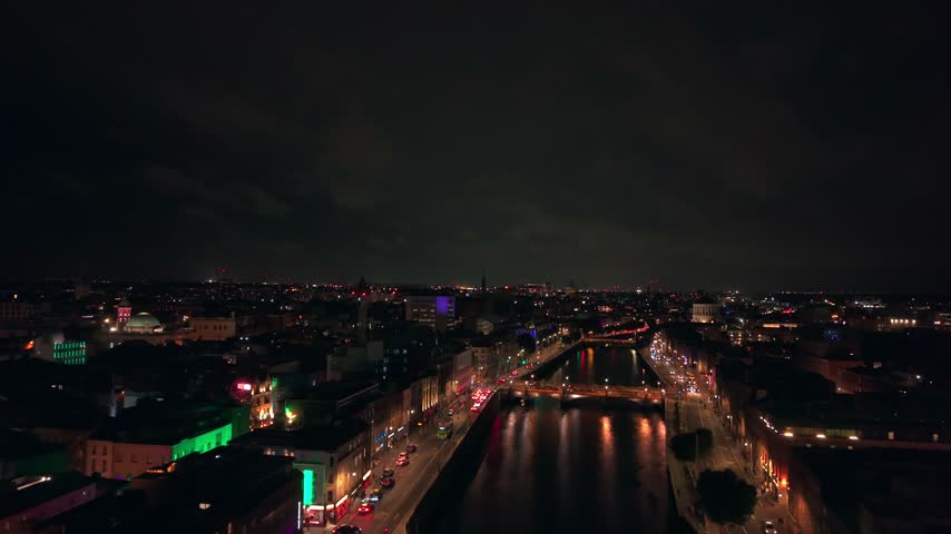 Wide 4K 50FPS aerial video of the River Liffey in Dublin City Centre, Temple Bar in Ireland at night. Produced in 3840x2160 and with Rec709 colour.