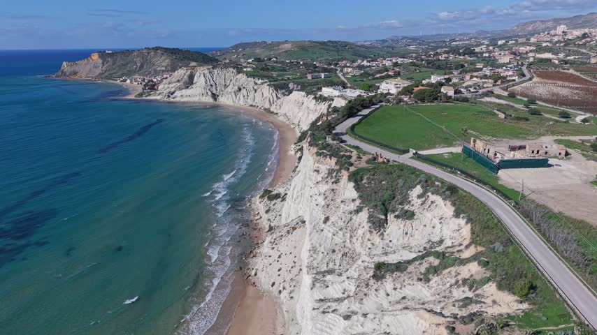 Aerial view of the white marl cliffs of Stair of the Turks along the coastline in Realmonte, Sicily, Italy.