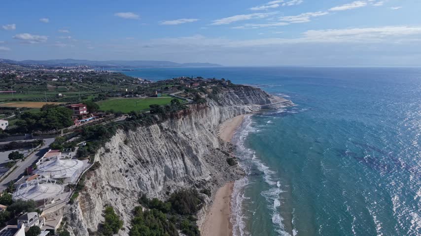 Aerial view of Stair of the Turks white marl cliffs along the Mediterranean Sea coast in Realmonte, Sicily, Italy.