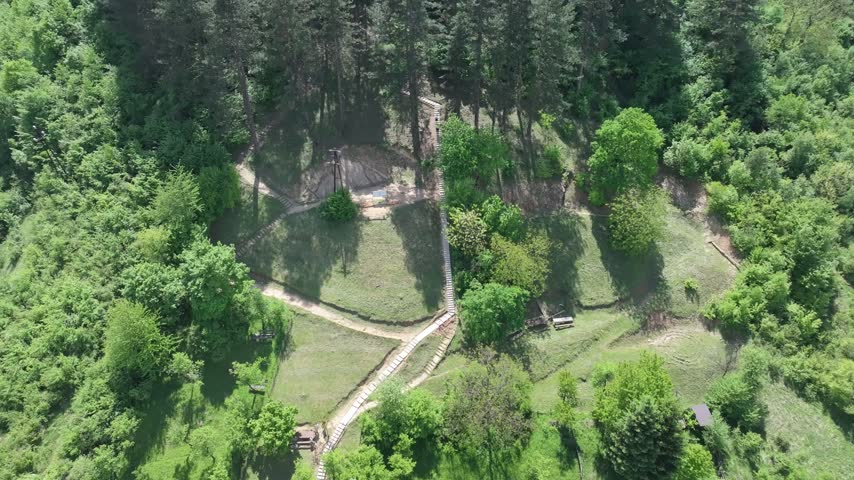 Aerial view of the lush green forested hills and walking paths of the Visoko area in Visoko, Federation of Bosnia, Bosnia and Herzegovina.