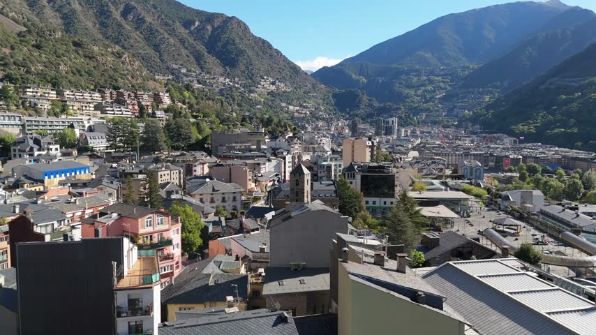 Aerial view of the city of Andorra la Vella nestled in the Pyrenees mountains with dense urban buildings and rooftops in Andorra la Vella, Andorra la Vella, Andorra.